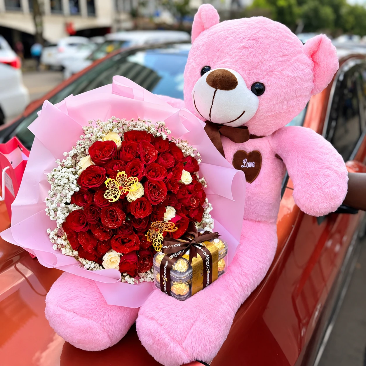 100cm pink teddy bear with 40 red roses and Ferrero Rocher 16 pieces in Nairobi