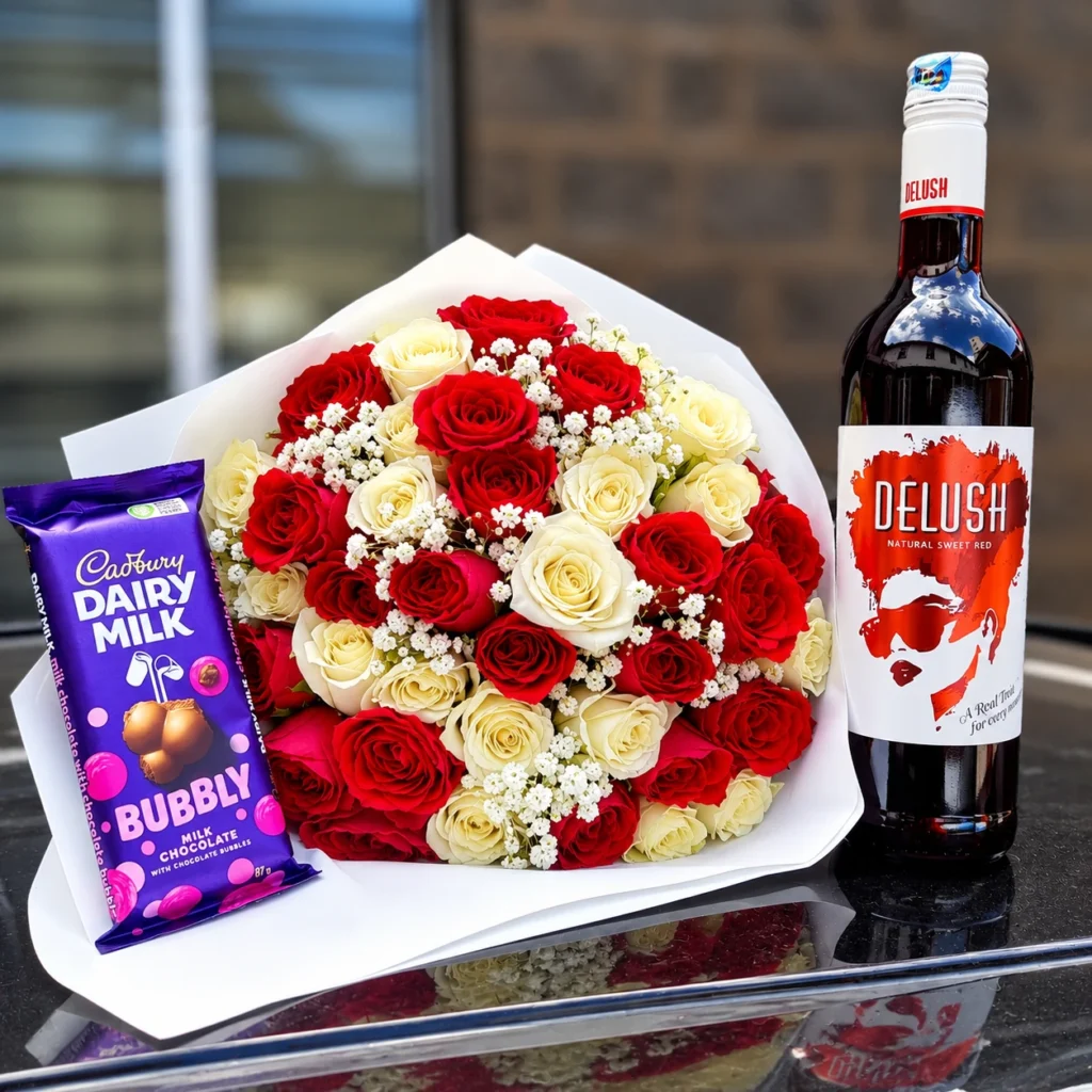 35 red and ivory roses with Delush sweet red wine and Cadbury Dairy Milk Bubbly in Nairobi