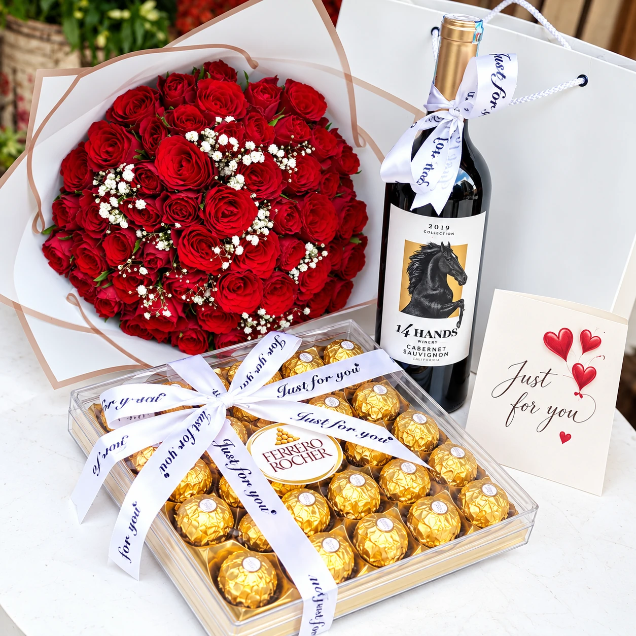 50 red roses with Ferrero Rocher 24 pieces and 14 Hands Cabernet Sauvignon wine in Nairobi