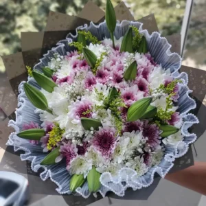 Pink and white chrysanthemums with lily buds and baby's breath bouquet in Nairobi