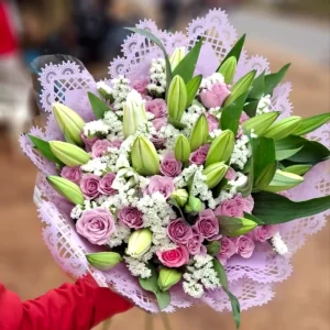Lilies and lilac roses bouquet with white filler flowers in Nairobi