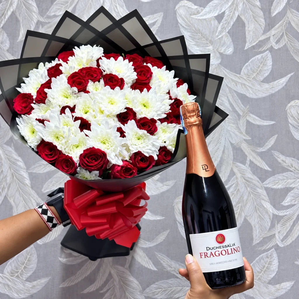 Red roses and white chrysanthemums bouquet with Fragolino wine in Nairobi
