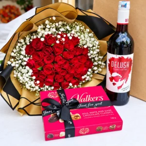 Red roses bouquet with Delush sweet red wine and Walkers chocolates in Nairobi